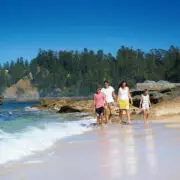 Family on Slaughter Bay. Courtesy of Norfolk Island Tourism. Photography by Robin Nisbet. | Moving to Norfolk Island | Living on Norfolk Island