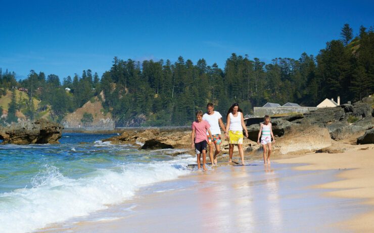 Family on Slaughter Bay. Courtesy of Norfolk Island Tourism. Photography by Robin Nisbet. | Moving to Norfolk Island | Living on Norfolk Island