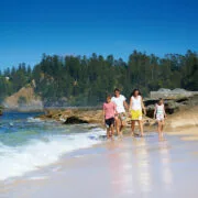 Family on Slaughter Bay. Courtesy of Norfolk Island Tourism. Photography by Robin Nisbet. | Moving to Norfolk Island | Living on Norfolk Island
